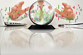 Crystal ball and businessman with chart graphs