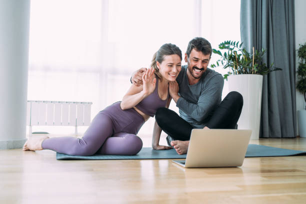 istock Couple exercising together at home. 1481389557
