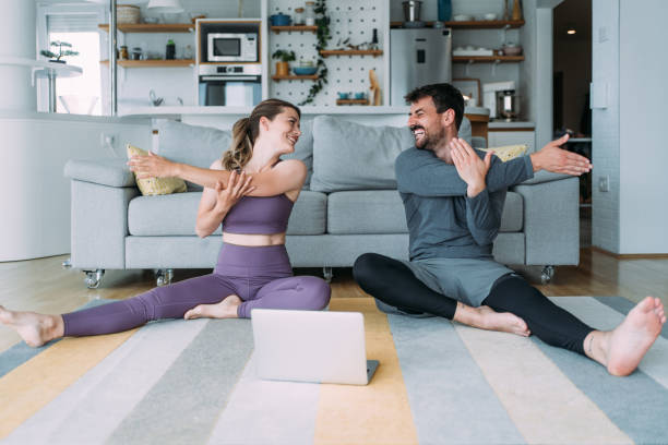 istock Couple exercising together at home. 1481389591
