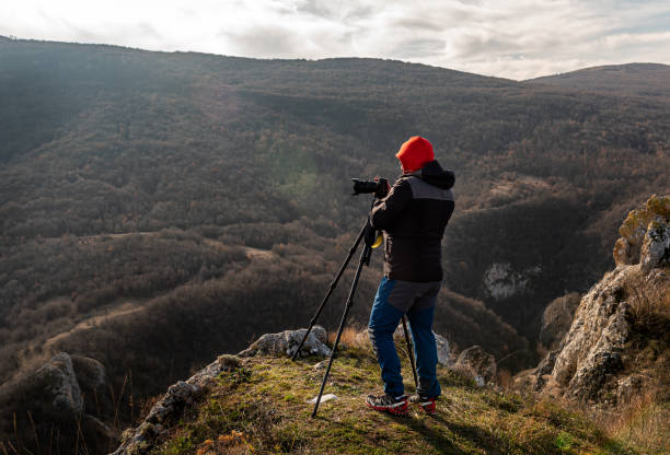 istock Photographer taking photos in mountains 1481389757