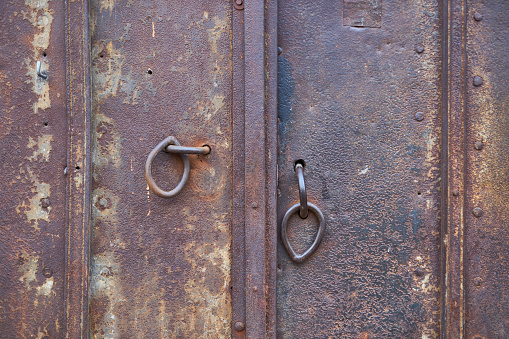 morocco knocker in africa the old wood  facade home and rusty safe padlock