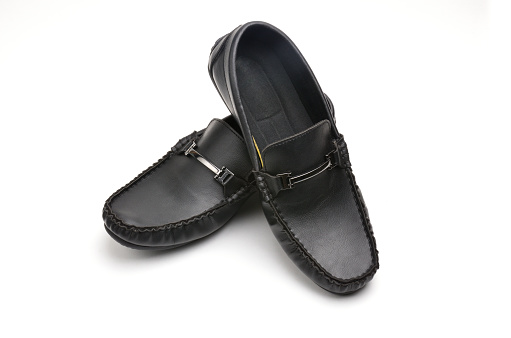 Men's leather shoes in the style of moccasins on an isolated white background