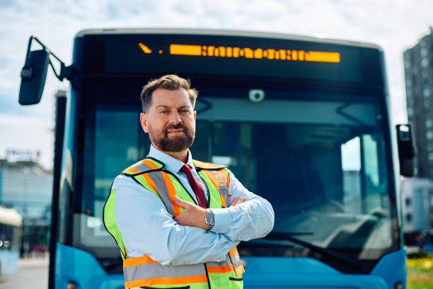 istock Professional bus driver with crossed arms looking at camera. 1481399728