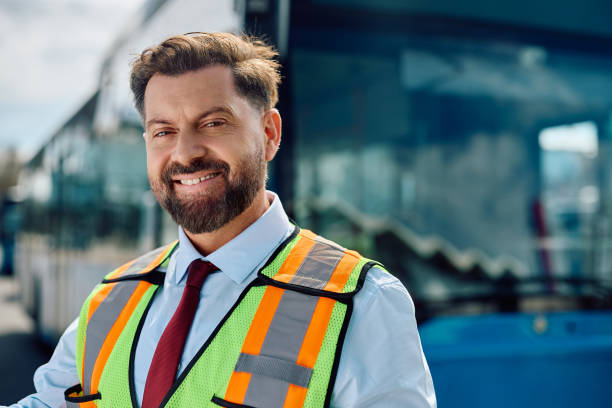 istock Happy mid adult bus driver looking at camera. 1481399777