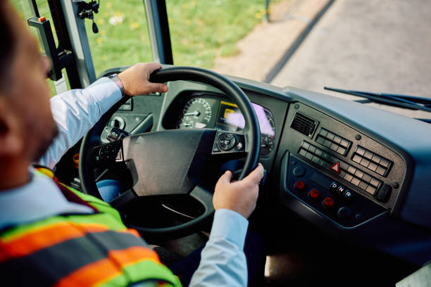 istock Close up of bus driver driving a bus. 1481399853