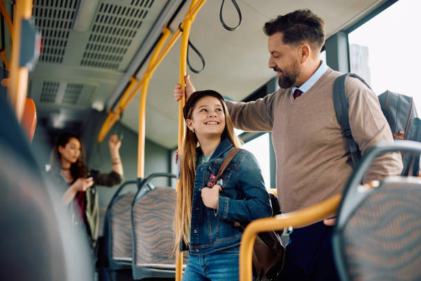 istock Happy father and daughter talking while commuting by public transport. 1481399912
