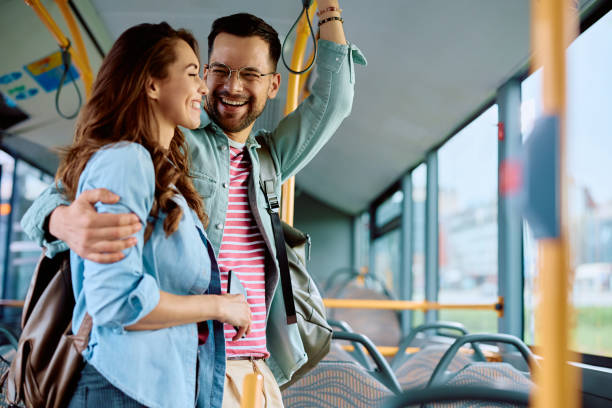 istock Cheerful couple having fun while riding in a bus. 1481400053