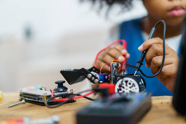 istock Little girl enjoy assembly a robot. 1481400128