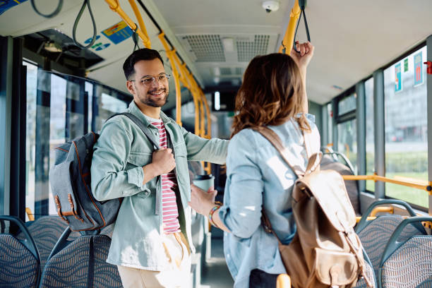 istock Young happy couple talking while commuting by bus. 1481400386