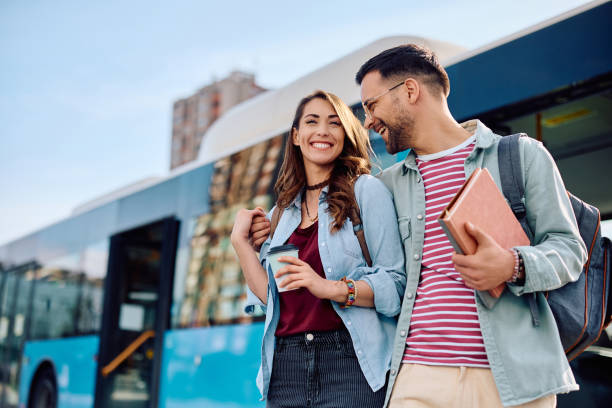 istock Happy couple walking embraced at bus station. 1481400468