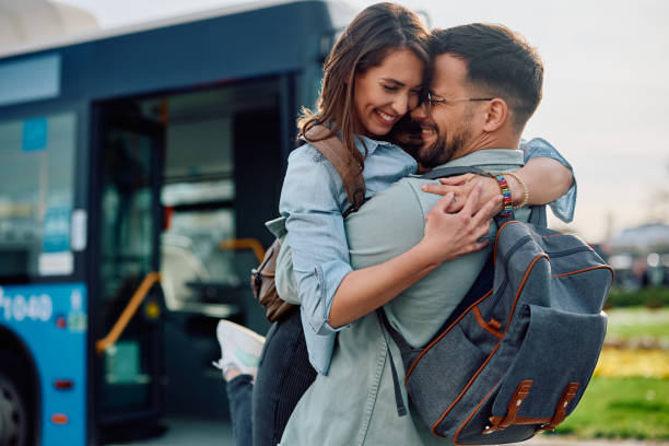 istock Happy couple in love greeting at bus station. 1481400607