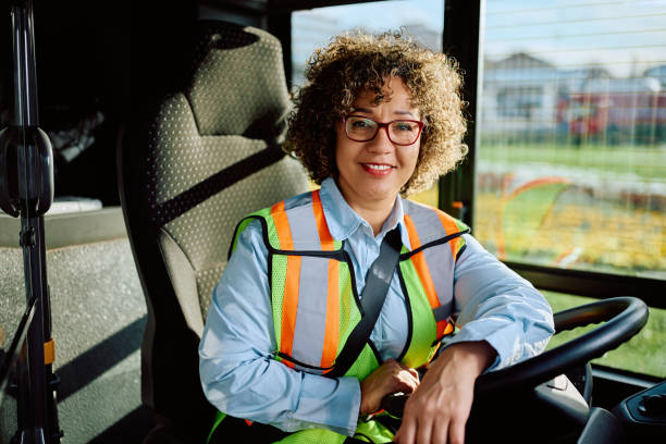 istock Happy female driver in public bus looking at camera. 1481401001