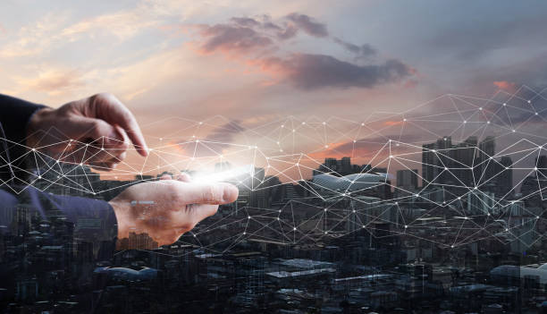 istock Business communication concept, mobile phone with white screen in hands on the backgound of city and cloudy sky 1481404620