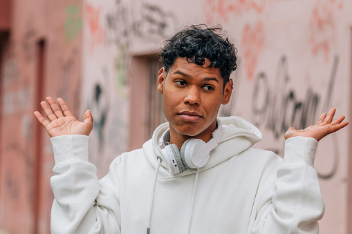 young man in the street with an expression of agreement