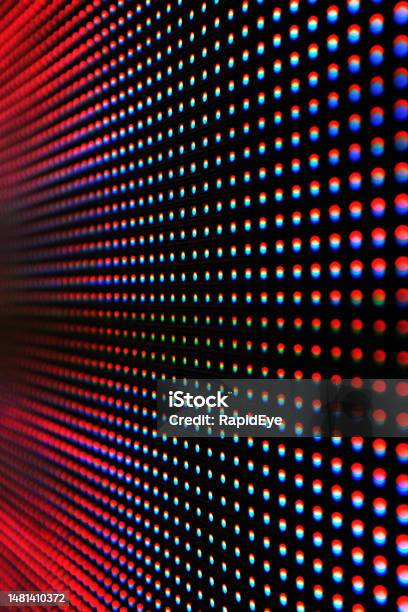 Detail Of A Modern Led Sign Showing Individual Pixels In Shades Of Red And Pink Stock Photo - Download Image Now