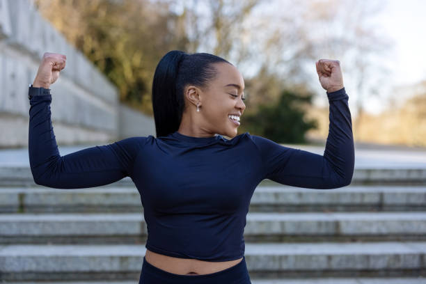 istock African sportswoman showing her biceps at park 1481410574