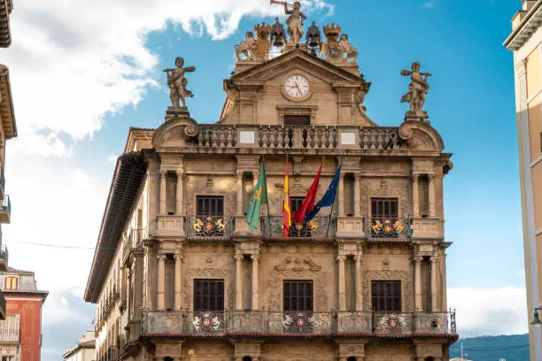 PAMPLONA , NAVARA - SPAIN .View of Consistorial Square and Town Hall building. Spanish and Navarra Flag. Beautiful architecture.