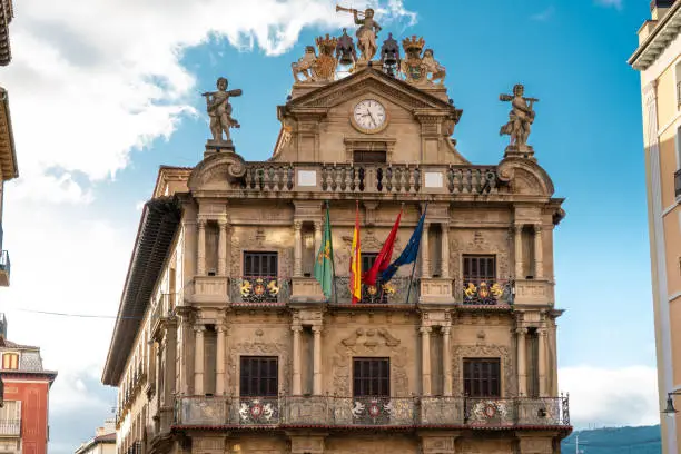 PAMPLONA , NAVARA - SPAIN .View of Consistorial Square and Town Hall building. Spanish and Navarra Flag. Beautiful architecture.