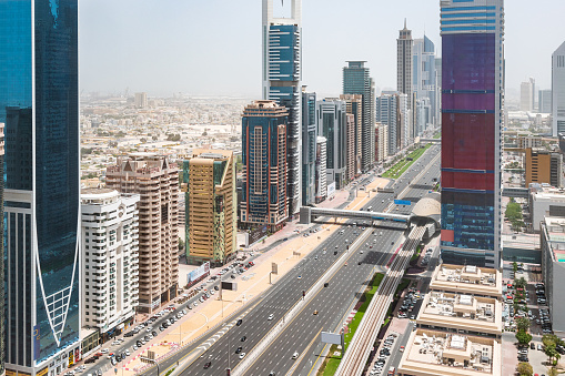Modern skyscrapers at along E11 Sheikh Zayed Road highway, near Financial Center metro station, Dubai, United Arab Emirates.