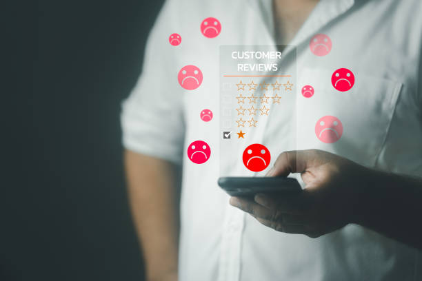 istock Unhappy man client with sadness emotion use on a smartphone give bad reviews, 1481418452