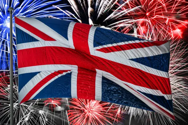 British UK flag on fireworks background, King Charles coronation holiday celebration