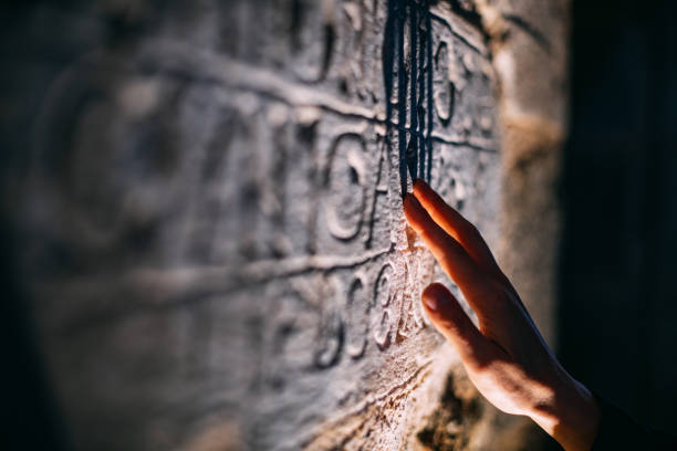 istock Archaeologist Examines Ancient Inscription 1481419356