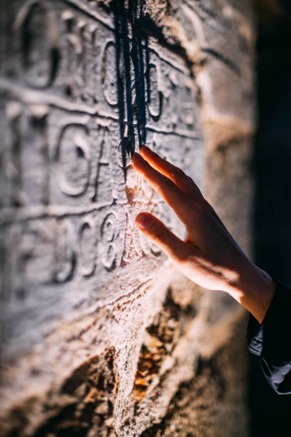 Archaeologist Examines Ancient Inscription