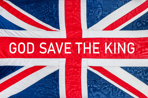 Dios salva al rey escribió una bandera británica del Reino Unido, fondo de Union Jack, celebración de la coronación del rey Carlos photo
