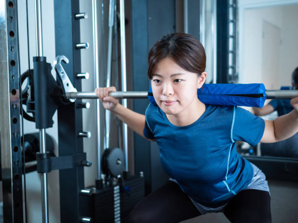 istock Woman squatting on power rack 1481422666