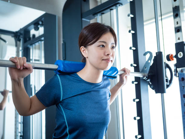 istock Woman squatting on power rack 1481422689
