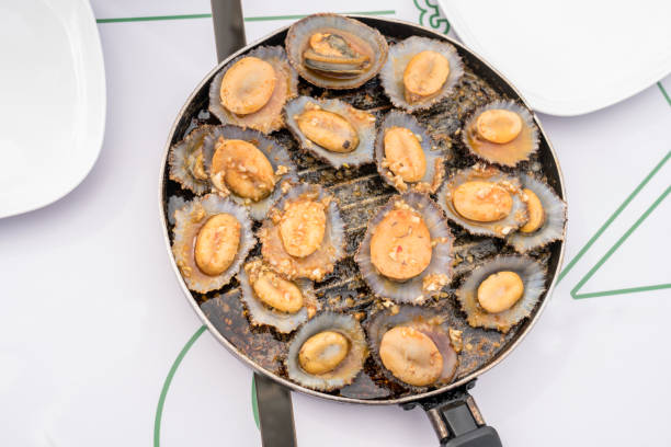 Directly above grilled limpets mussels on table. Gourmet food in Azores