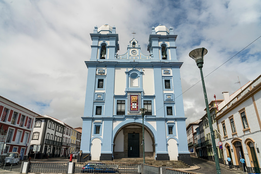Angra do Heroísmo, Portugal - 24 September 2022: Church of Mercy on sunny day. Few people on the street and almost no traffic.