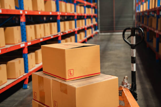 istock Interior warehouse storage and cardboard boxes against boxes on pallet. 1481424152