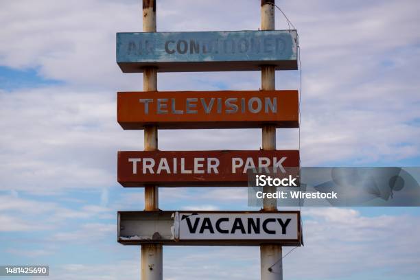 Fading Decrepit Old Trailer Park Sign For A Longgone Trailer Park In The California Desert Stock Photo - Download Image Now