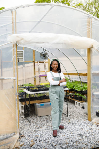 Farmer In Her Greenhouse