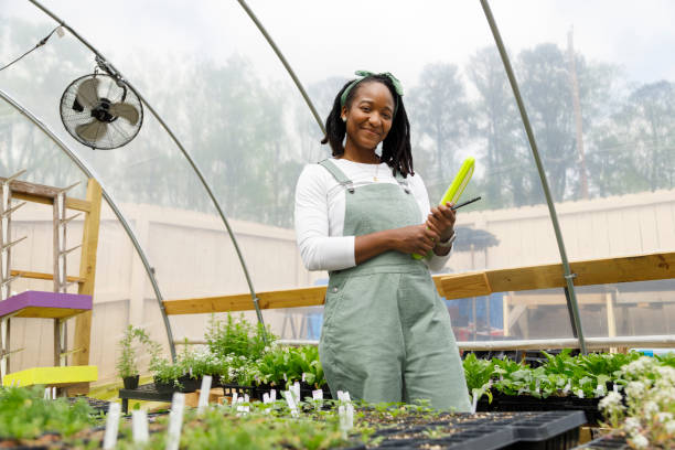 istock Farmer In Her Greenhouse 1481425800