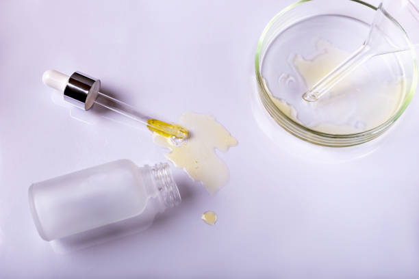 istock Cosmetic bottle with dropper and petri dish with laboratory funnel 1481430113