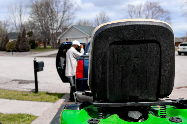 An older , and well used, lawnmower with a clipping path.