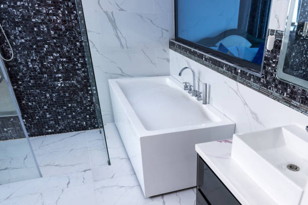 istock Bath tub with White foam soap bubbles. Modern ceramic bathtub 1481432500
