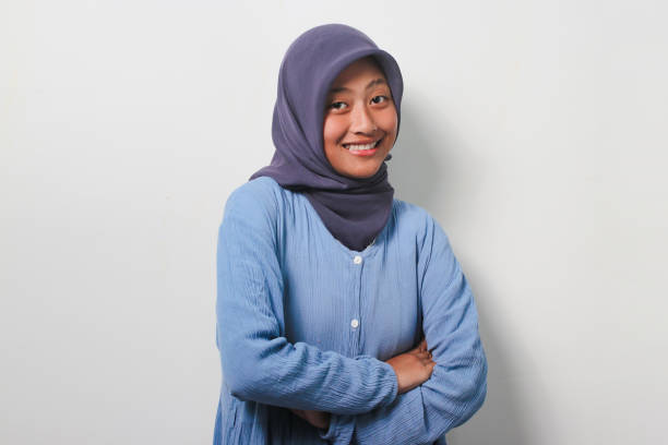 istock Young Asian girl in hijab smiling while looking at camera 1481437777