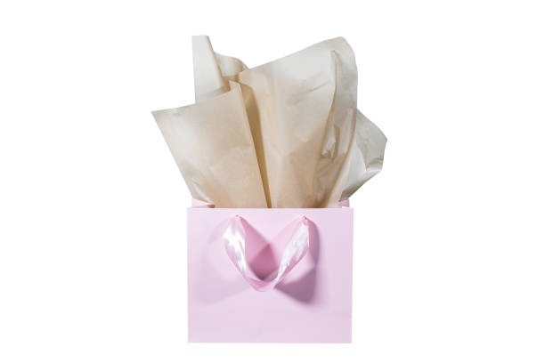 istock Craft paper gift bag with tissue paper isolated on a white background 1481438184