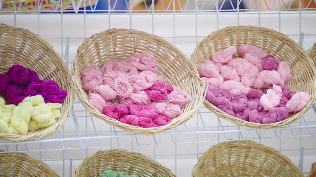 Colourful yarn wool on basket in store