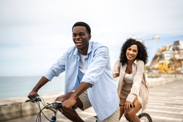 istock Young coupe during a bike ride on a coastline 1481443829