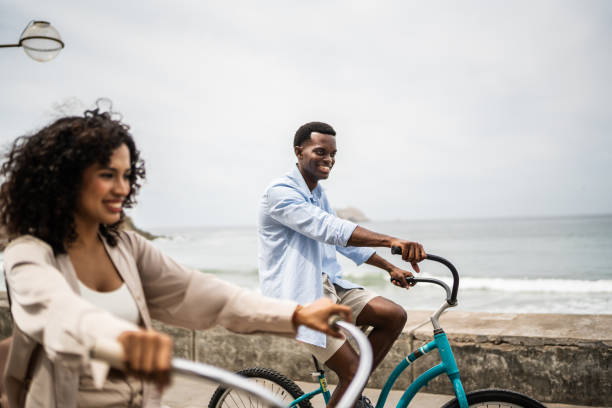 istock Young couple on a bicycle ride on the seacoast 1481444280