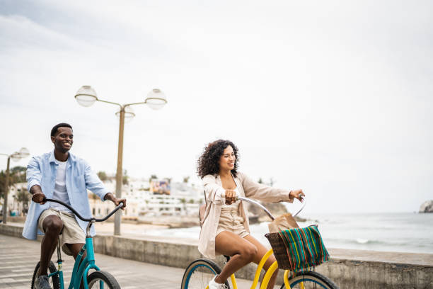 istock Young couple on a bicycle ride on the seacoast 1481444377