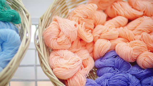 Colourful yarn wool on basket in store