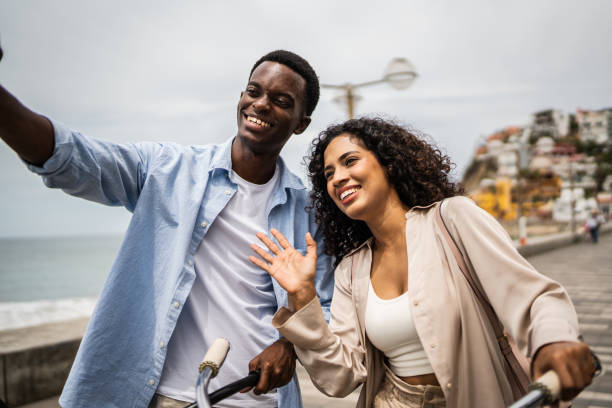 istock Young couple taking a selfie or filming on the coastline 1481445861