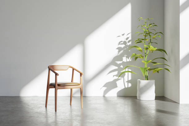 Modern minimalist interior with an armchair on empty white wall background.3D rendering