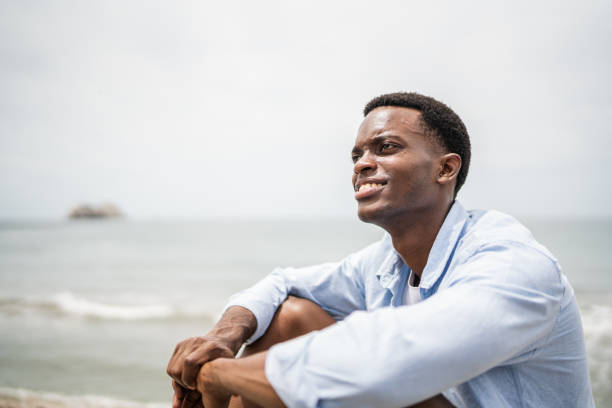 istock Young man contemplating on the coastline 1481446062