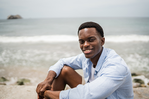 Portrait of young man on the coastline